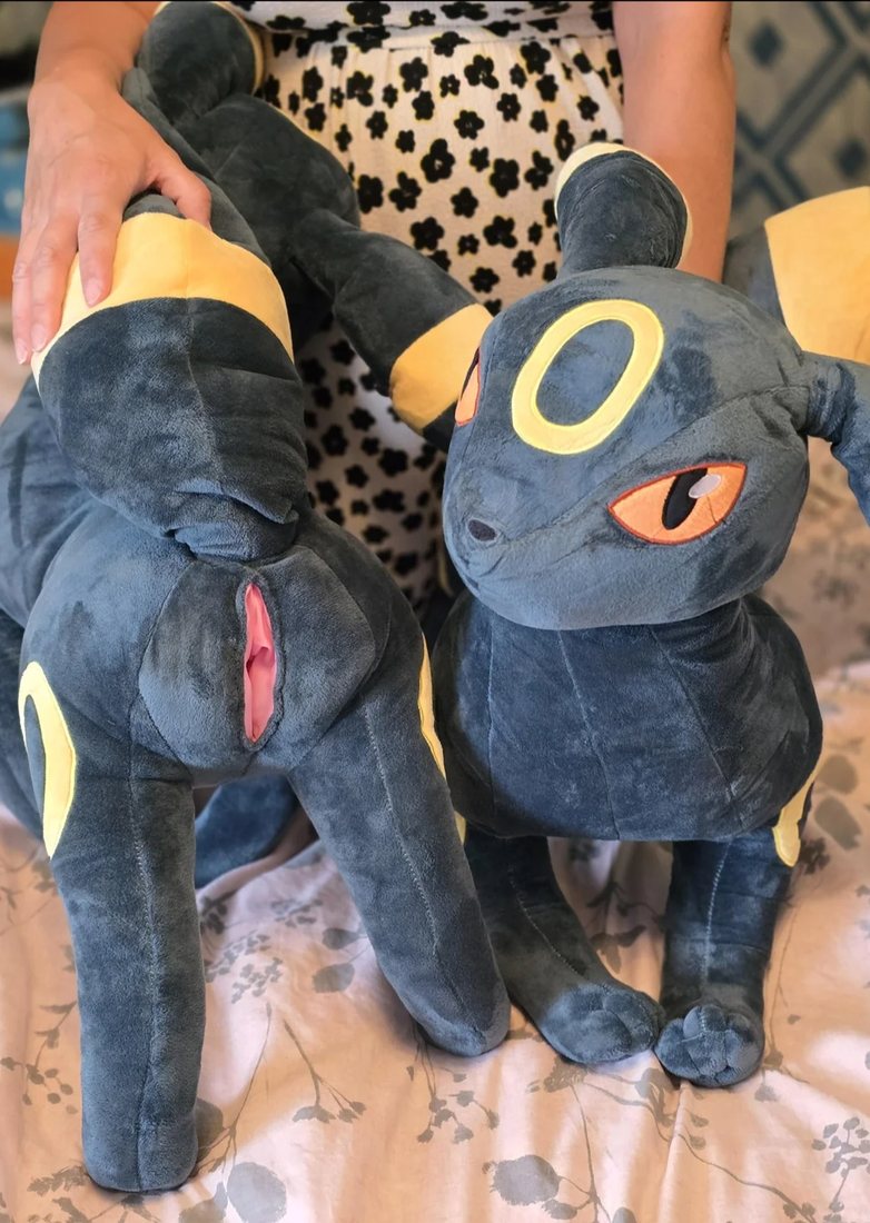 Two Umbreon plushies, one turned to show the SPH and one facing forward